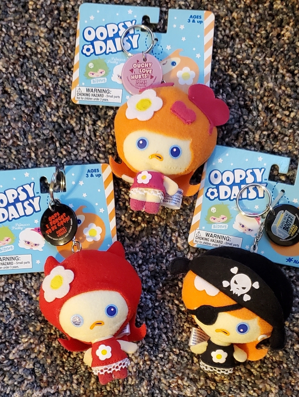 3 Oopsy Daisy Doll Keychains: Love Hurts, Forgot to be Good, Hands off my Booty